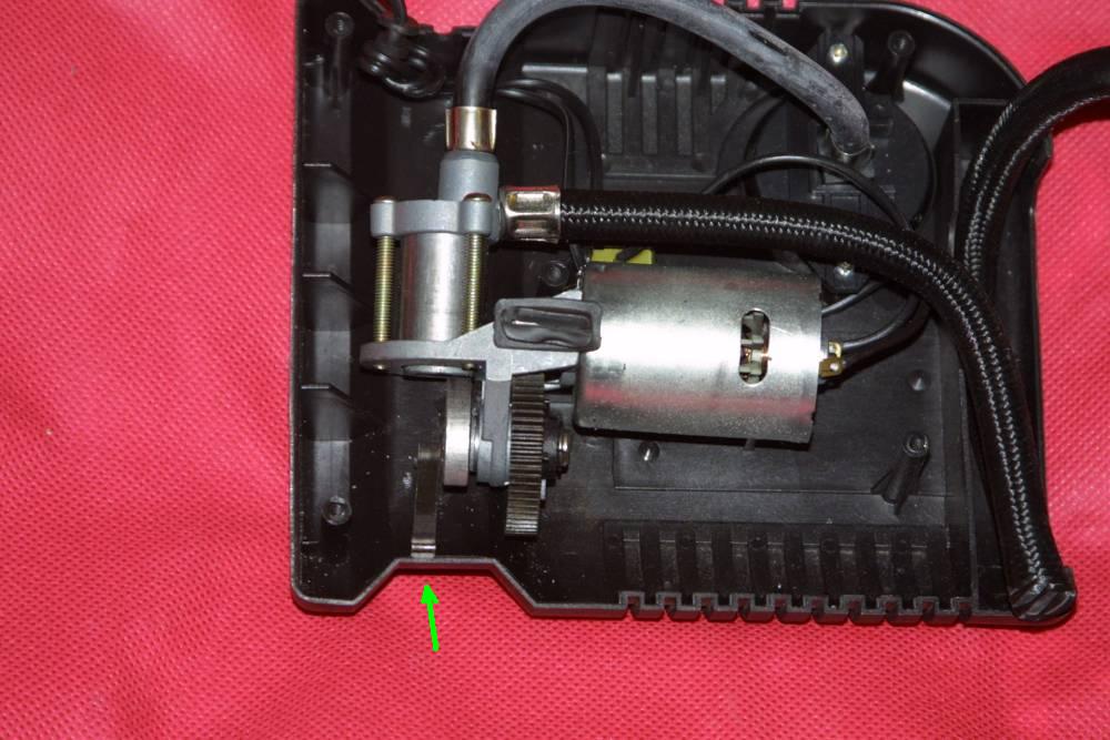 The arrow shows where the connecting rod broke.
